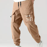 kkboxly  Smile Print, Men's Drawstring Cargo Pants, Flap Pocket Loose Trendy Jogger Pants, Mens Work Pants