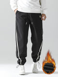 kkboxly  Men's Stripe Pattern Casual Tapered Trousers Solid Casual Long Cropped Drawstring Pants Streetwear For Men