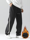 kkboxly  Men's Stripe Pattern Casual Tapered Trousers Solid Casual Long Cropped Drawstring Pants Streetwear For Men
