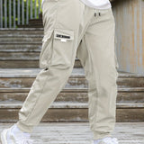 kkboxly  Men's Drawstring Cargo Pants With Flap Pockets, Loose Casual Comfy Jogger Pants