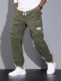 kkboxly  Men's Stylish Solid Corduroy Cargo Joggers With Pockets, Causal Breathable Drawstring Men's Bottom Clothing For City Walk Street Hanging Outdoor Activities