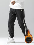 kkboxly  Men's Stripe Pattern Casual Tapered Trousers Solid Casual Long Cropped Drawstring Pants Streetwear For Men