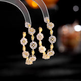 2025 Korean version of fashionable retro earrings, cold wind personality, black bottom circle, colored zircon silver needle earrings, flower earrings.