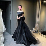 2025 Black dress skirt  new one-word shoulder  light luxury niche fishtail skirt haute couture satin dress