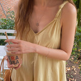 spring and summer new suspender dress v-neck design halter loose casual Korean version medium and long skirt
