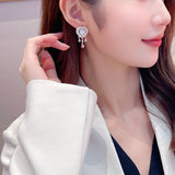 2025 S925 silver needle high-grade zircon inlaid pearl niche temperament earrings wholesale love-shaped water drop fringed earrings
