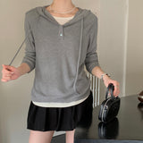 Hooded drawstring bottoming shirt women's spring new design versatile T-shirt V-neck shell buckle fake two-piece long-sleeved top