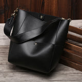 Factory spring and summer new women's bags, genuine leather, 2025 style cowhide bucket bags, shoulder portable shopping tide bags wholesale