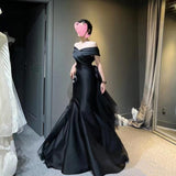 2025 Black dress skirt  new one-word shoulder  light luxury niche fishtail skirt haute couture satin dress