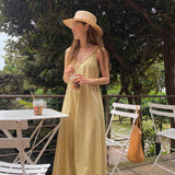 spring and summer new suspender dress v-neck design halter loose casual Korean version medium and long skirt
