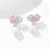 2025 S925 silver needle high-end earrings women's simple fashion sweet temperament love bow baroque pearl stud earrings