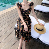2025 Black Xiaofei sleeve suspender floral dress women's summer seaside vacation  romantic retro slim hip wrap dress