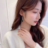 2025 S925 silver needle temperament women's earrings light luxury high-end niche design bright zircon inlaid long water drop earrings