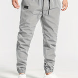 kkboxly  Men's Casual Tapered Trousers Solid Drawstring Casual Long Cropped Pants Streetwear For Men