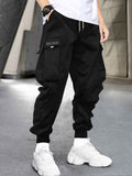 kkboxly Men's Stylish Letter Graphic Cargo Pants with Flap Pockets - Drawstring Waist for Comfort